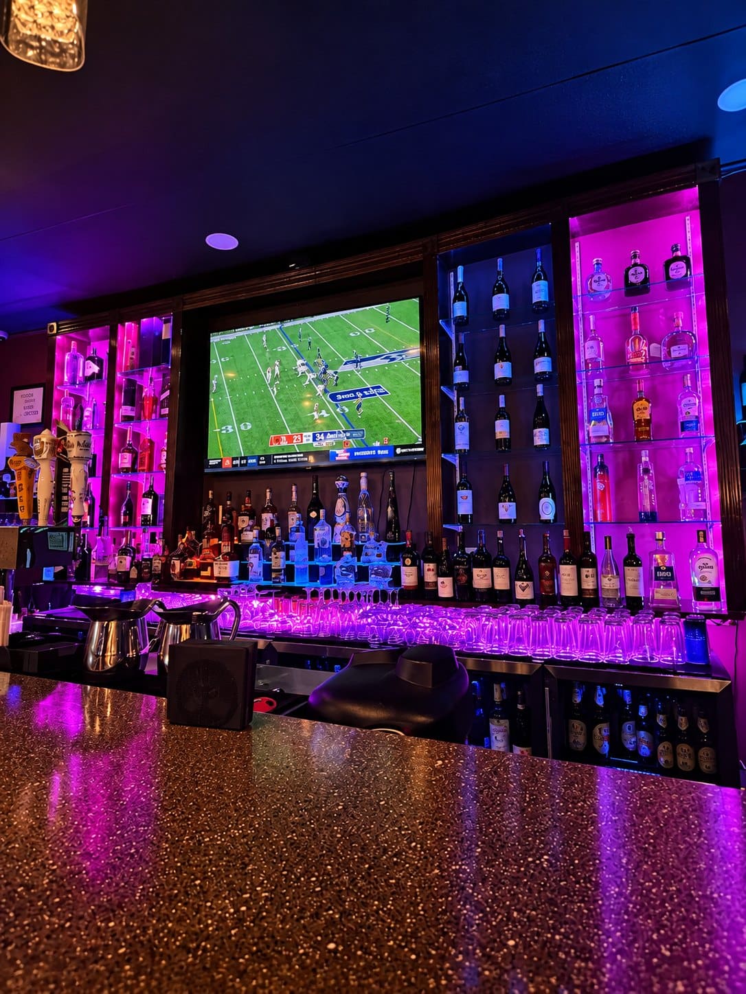 The lounge bar with the game on